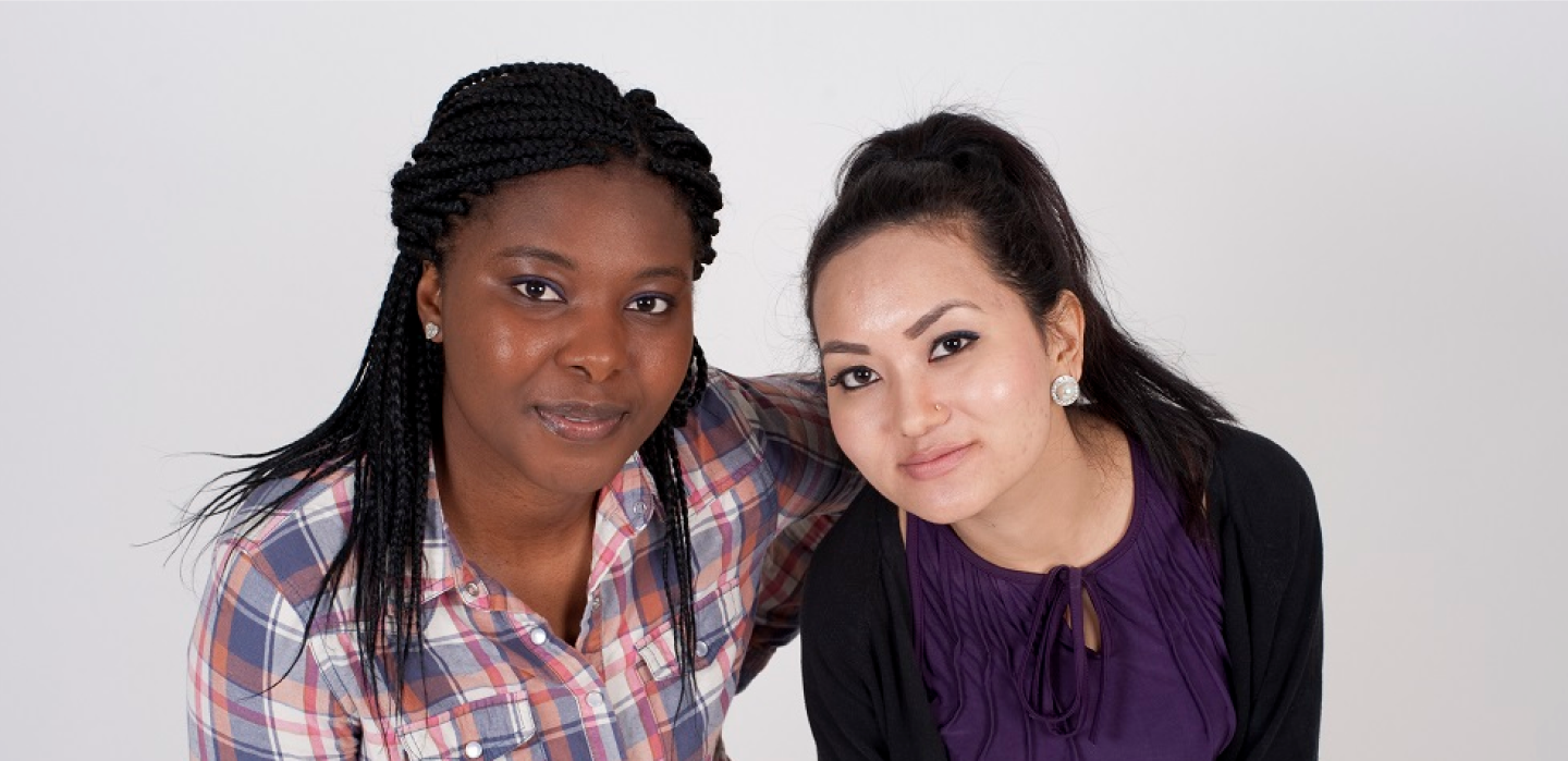Two young women look into the camera