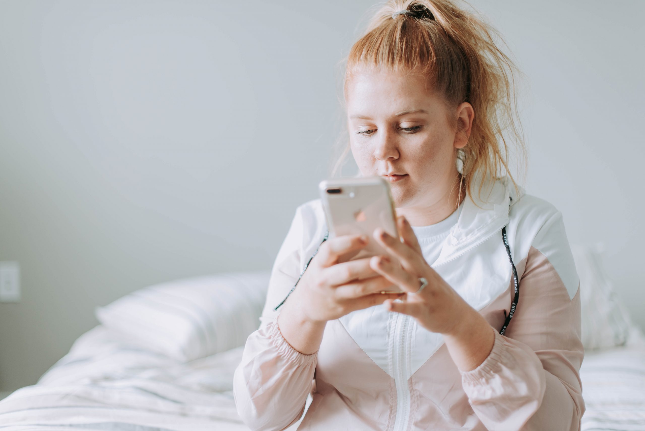 Young woman looking at her mobile phone.