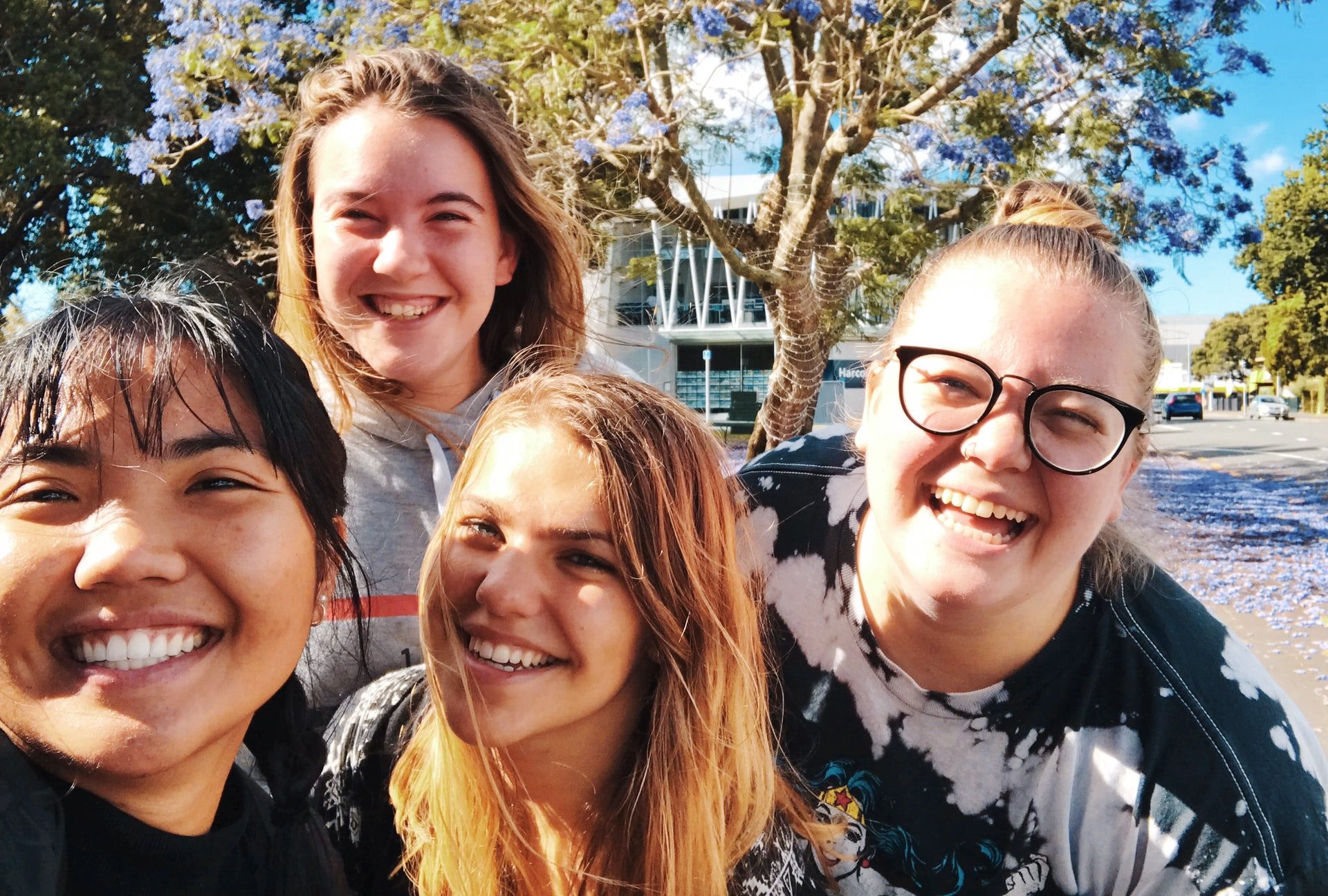 Four young women taking a selfie in the sunshine