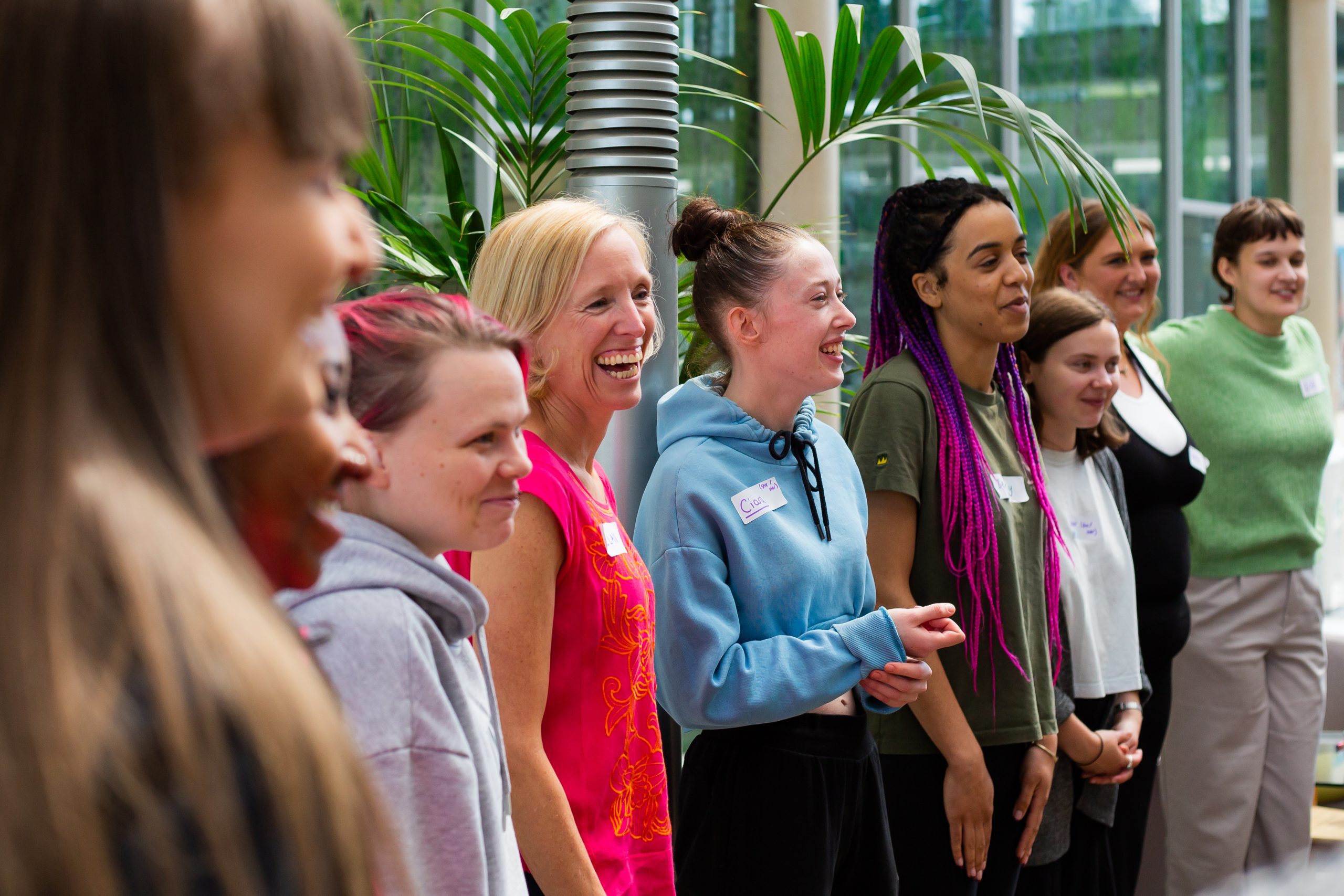 A group of young women laughing together.