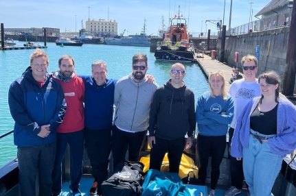 Wates group swimmers fundraise for Young Women's Trust by swimming The Channel from Jersey to France and back