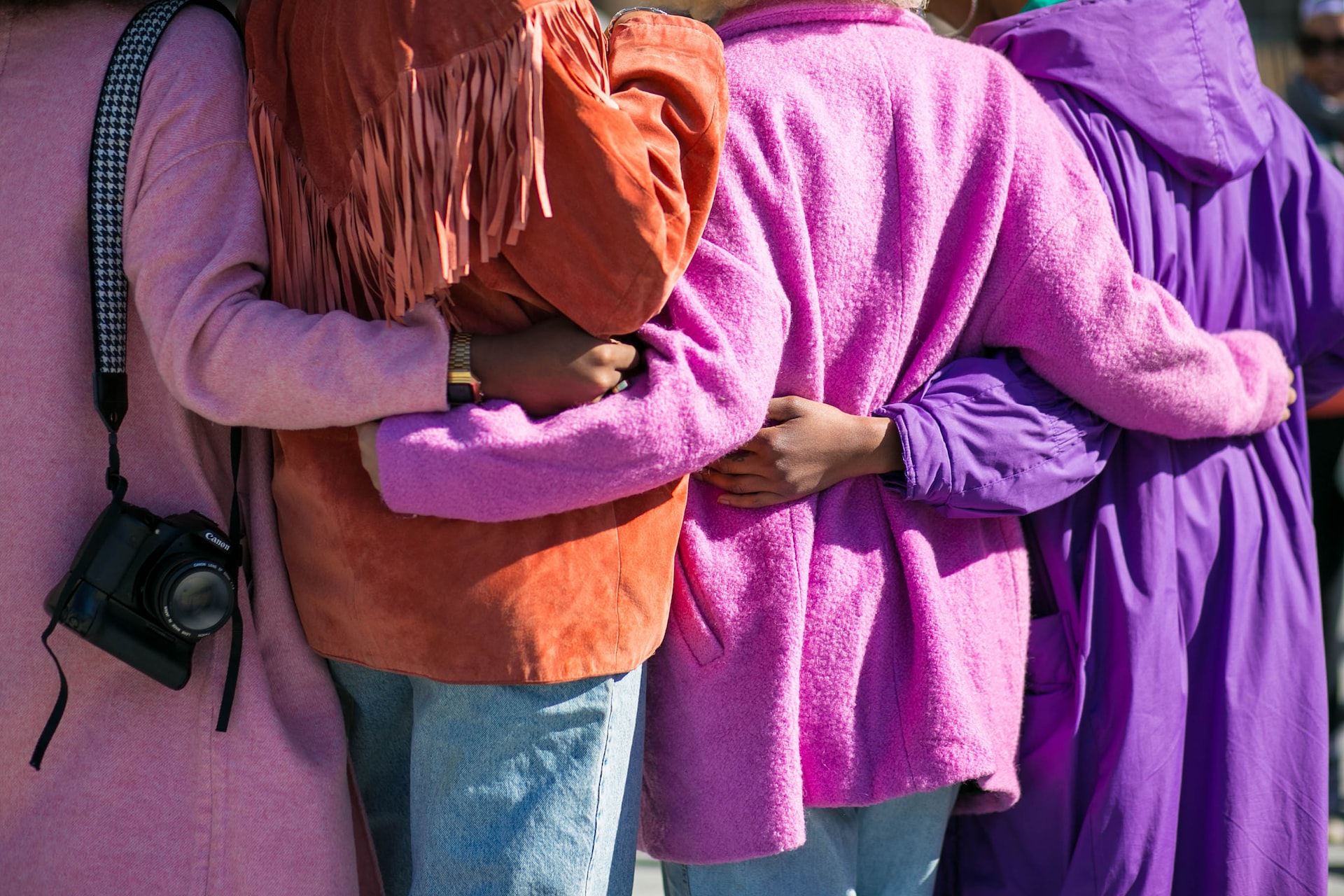 A group of women hugging each other