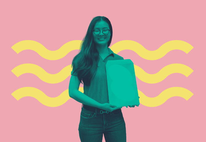 A young woman holding forward a notepad